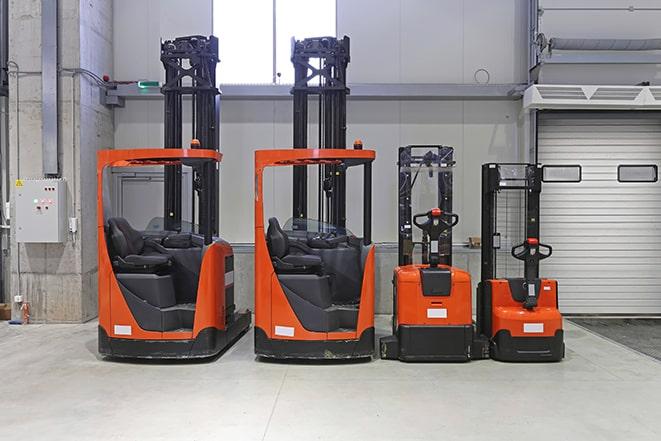 industrial forklifts parked in a row